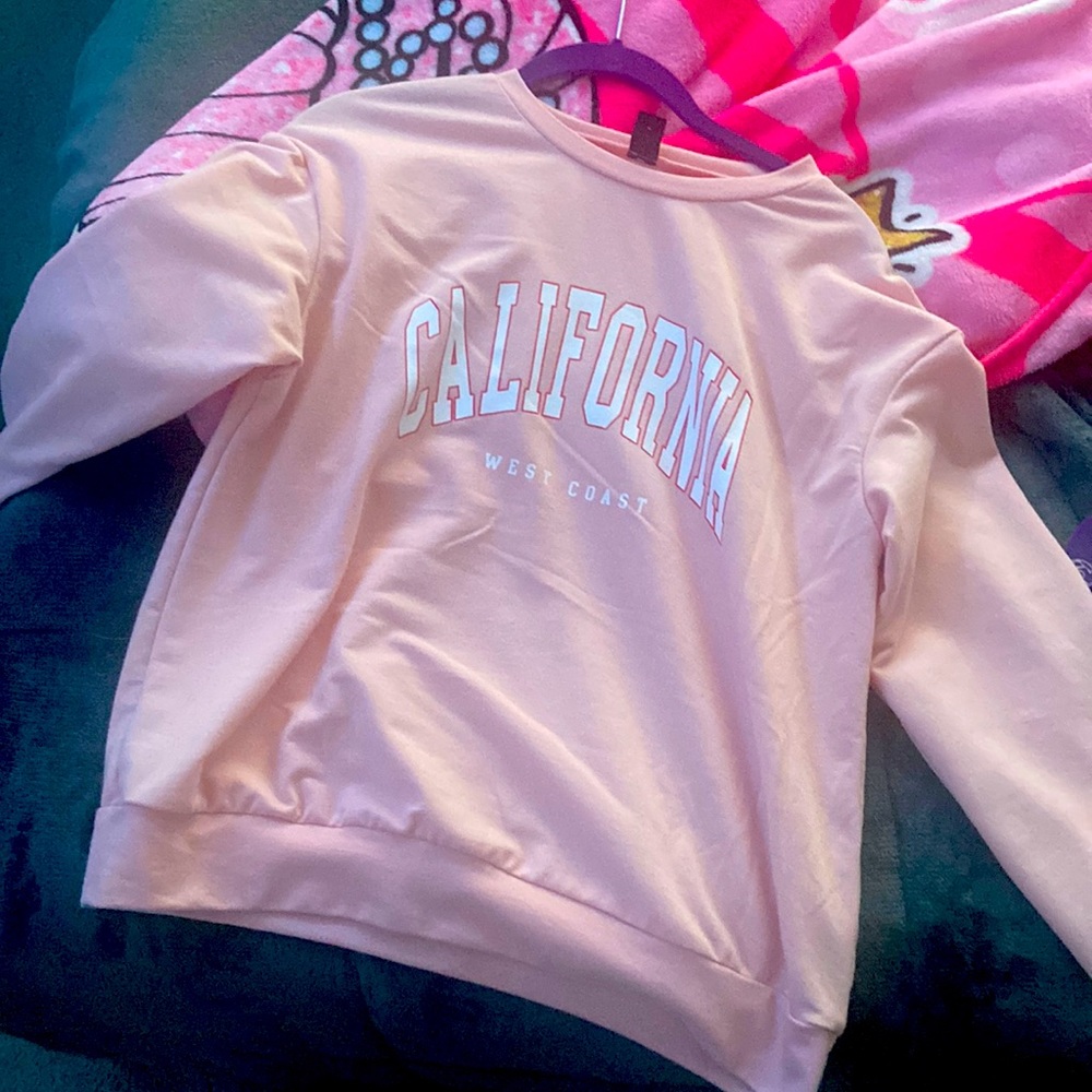 A pink and white California hoodie